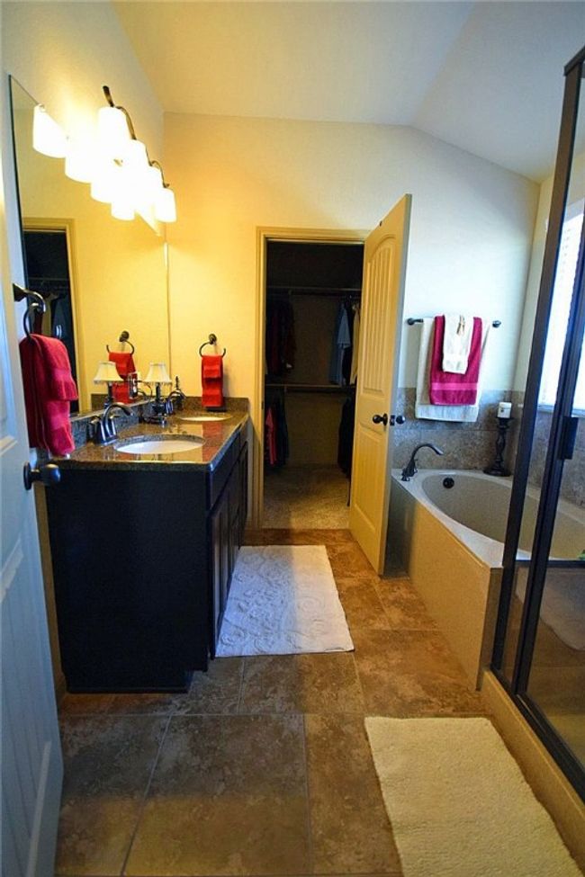 master bathroom with double vanity, bathtub and separate shower | Image 20