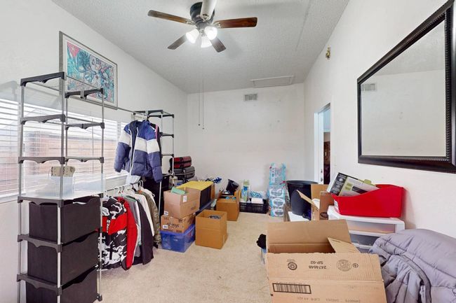 Storage featuring visible vents, attic access, and ceiling fan | Image 28