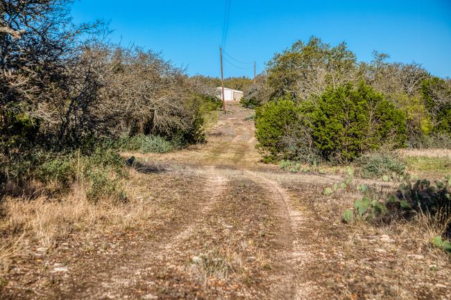 View of street with dirt driveway | Image 25