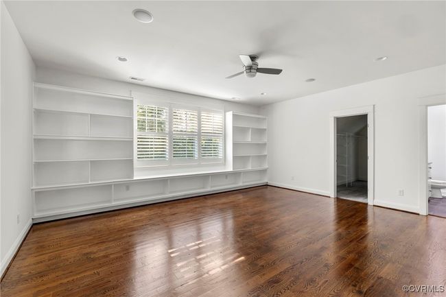 Spare room with ceiling fan and wood finished floors | Image 28
