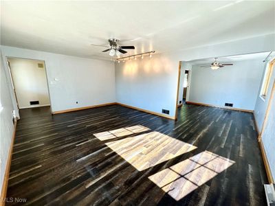 Living room featuring a ceiling fan | Image 3