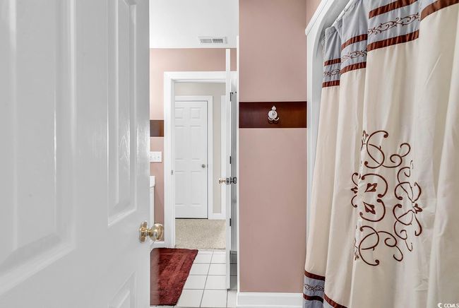 Full bath featuring visible vents, tile patterned flooring, and a shower with curtain | Image 16