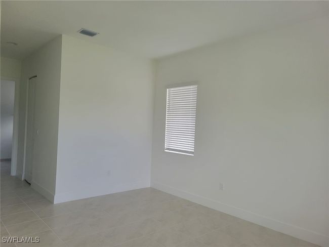 Empty room with baseboards | Image 13