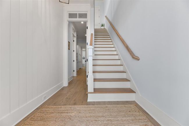Lower-level entry foyer featuring a shiplap accent wall. | Image 23