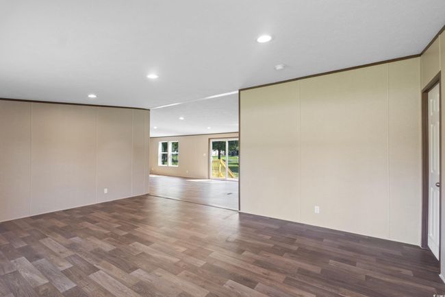 Unfurnished room with wood finished floors and recessed lighting | Image 32