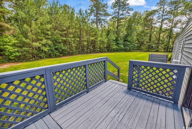 Wooden deck featuring a yard and stairs | Image 31