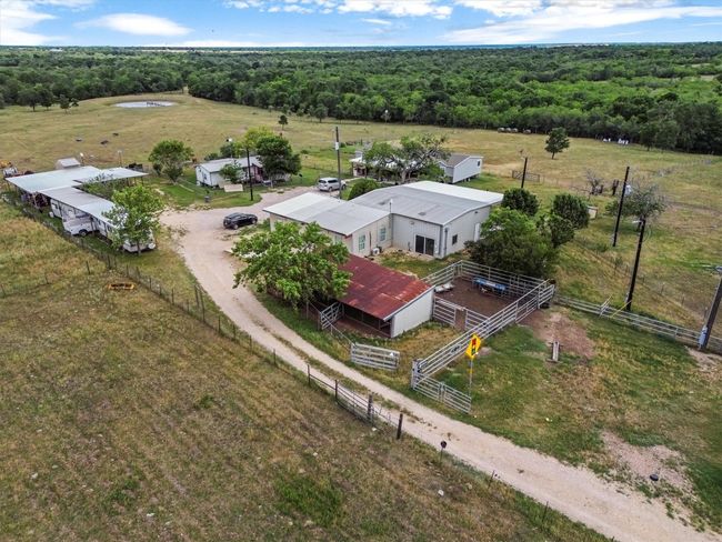 Tucked away on nearly 37 acres of peaceful Texas countryside, this one-of-a-kind property offers incredible versatility with over $250, 000 in improvements and four unique structures—making it the perfect canvas for a family compound, creative retreat, or income-producing estate. | Image 29