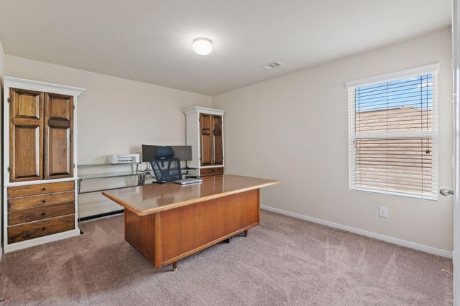 Secondary bedroom number 1 is being used as an office currently. | Image 32