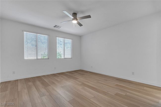 Spare room featuring a ceiling fan, light wood-style flooring, and baseboards | Image 22