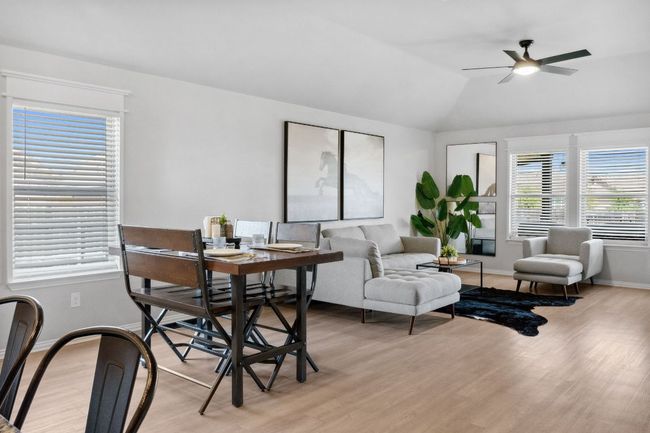 Natural light floods the home through windows surrounding the main level. | Image 14