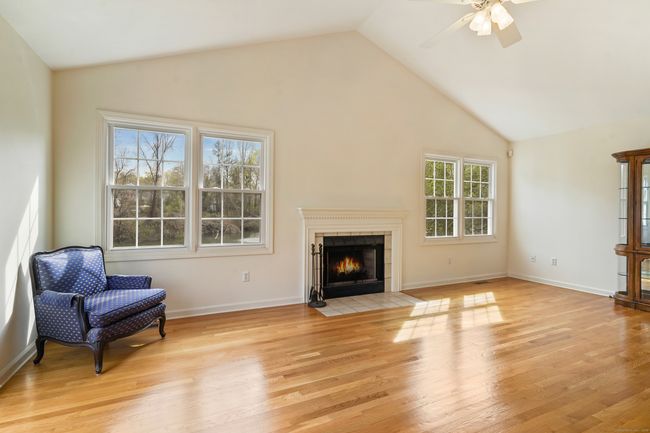 Living room with vaulted ceilings and views of the pond | Image 8