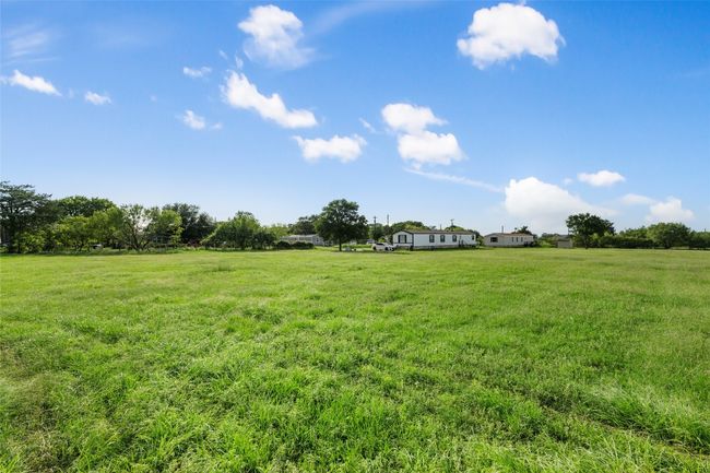 View of grassy yard with a view of rural / pastoral area | Image 4