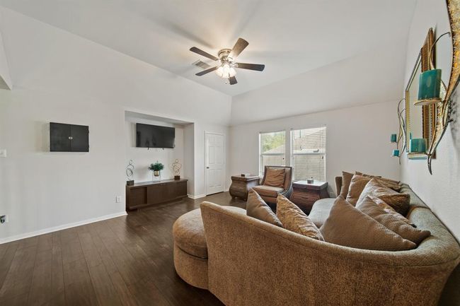 From cozy evenings to casual gatherings, this game room delivers comfort and style with a ceiling fan, built-in media nook, and welcoming atmosphere. | Image 34