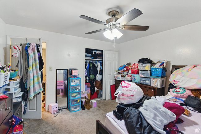 Bedroom featuring a closet, carpet flooring, and a ceiling fan | Image 29