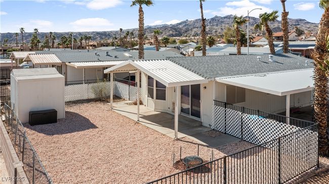 Back of property featuring fence private yard, a patio area, and a mountain view | Image 57