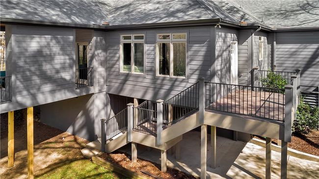 Door to tall crawl is under the sunroom/office by the staircase. | Image 42