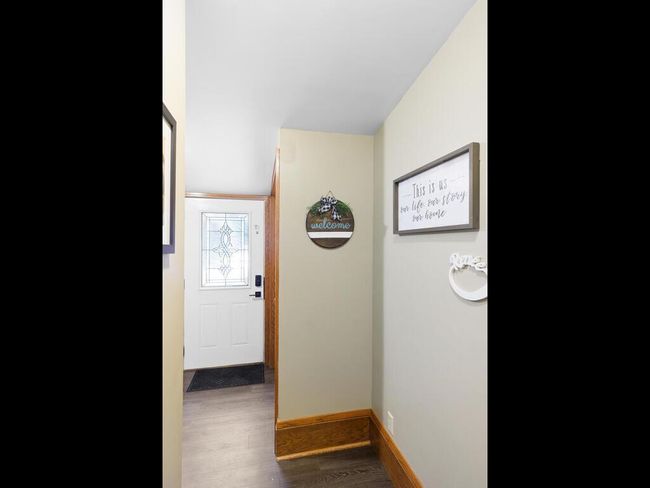 Entrance with coat closet and washer/dryer as you walk in | Image 16