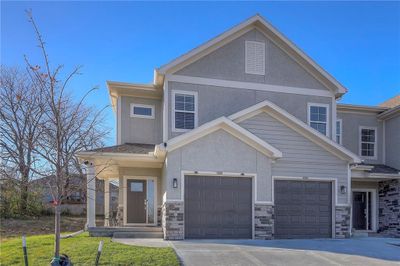 End unit townhouse featuring a garage | Image 1