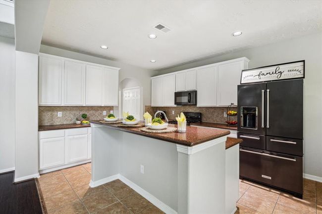 Charm, warmth and traditional elegance! This culinary kitchen includes a breakfast bar and is ready for you to entertain your guests. | Image 21