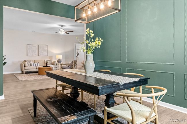 Dining space featuring baseboards, light wood finished floors, and ceiling fan | Image 27