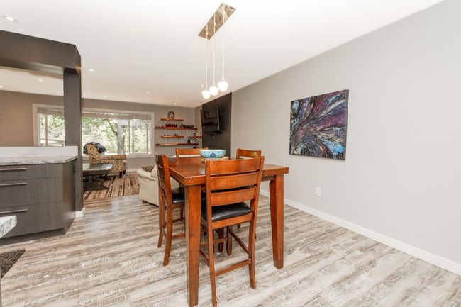 Dining area with light wood-style floors, baseboards, and recessed lighting | Image 11