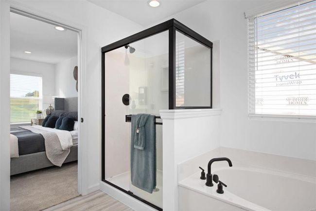 Bathroom with wood-type flooring, separate shower and tub, and plenty of natural light | Image 26