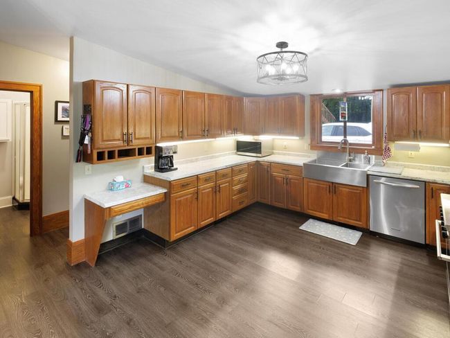 Huge kitchen. Tons of cabinet space, built in desk with mail slots | Image 22