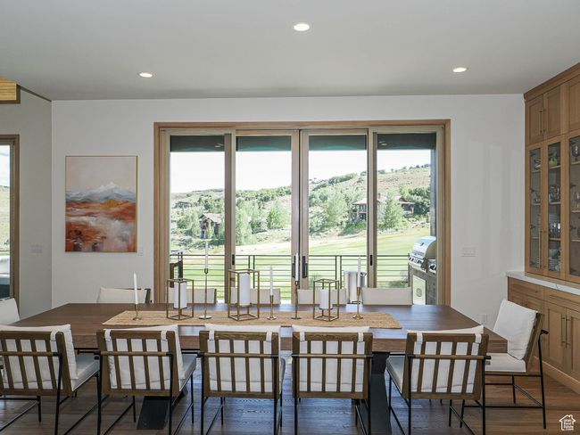 Dining area with plenty of natural light, wood finished floors, and recessed lighting | Image 38