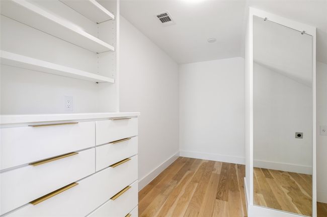 Primary walk in closet with room for customization and washer and dryer hook up | Image 18