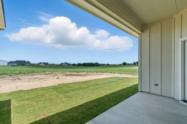 View of green lawn with a patio area | Image 24