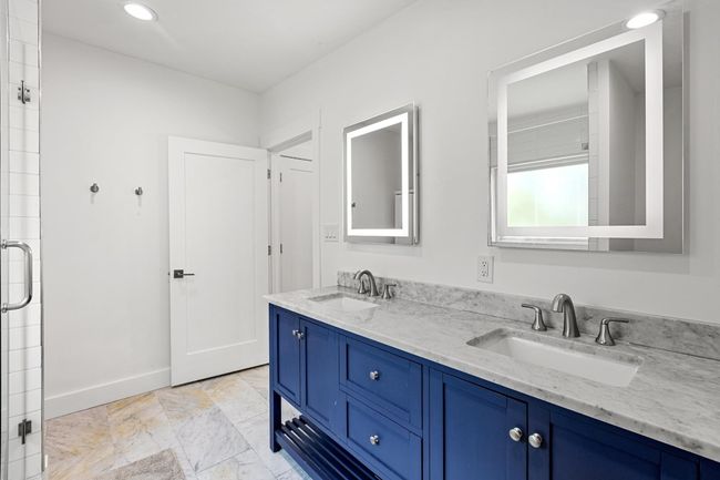 Bathroom featuring a sink, baseboards, double vanity, and recessed lighting | Image 25