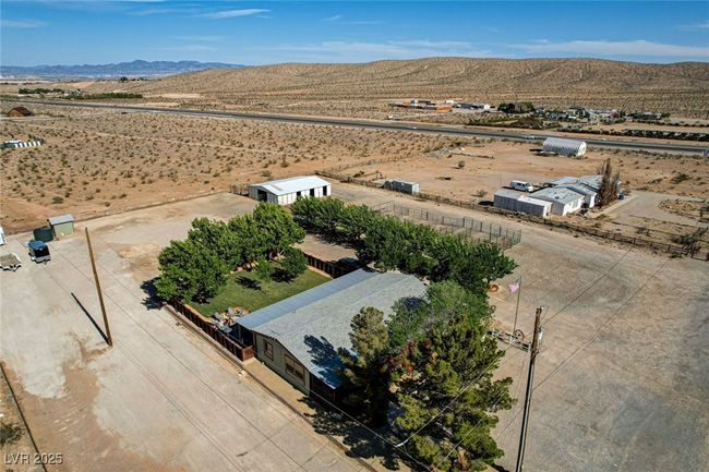 View of rural area featuring a mountainous background and a desert landscape | Image 55