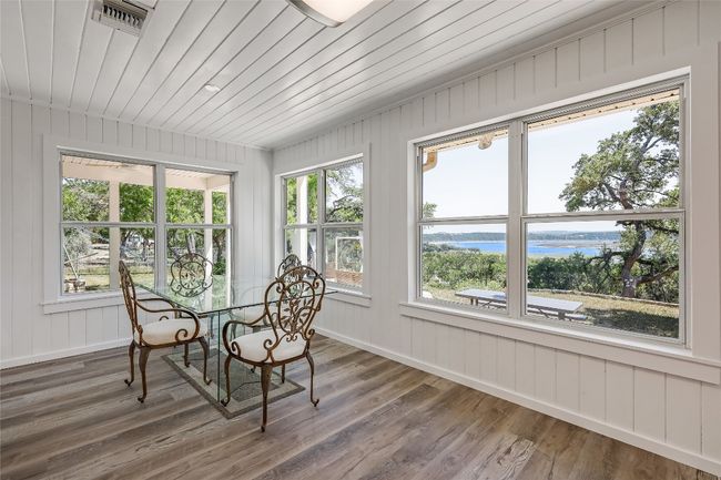 Versatile space full of natural light and numerous windows. Another great place to entertain or dine. | Image 10