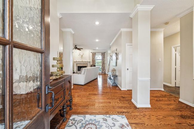 Enter into a spacious open floor plan leading seamlessly to the inviting family room. | Image 5