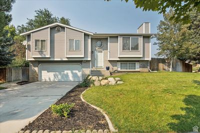 Raised ranch with a front yard and a garage | Image 2