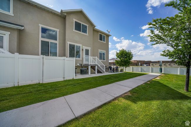 Rear view of property with a patio area and stucco siding | Image 33