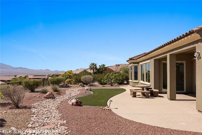 View of yard with fence, a patio, and a mountain view | Image 61
