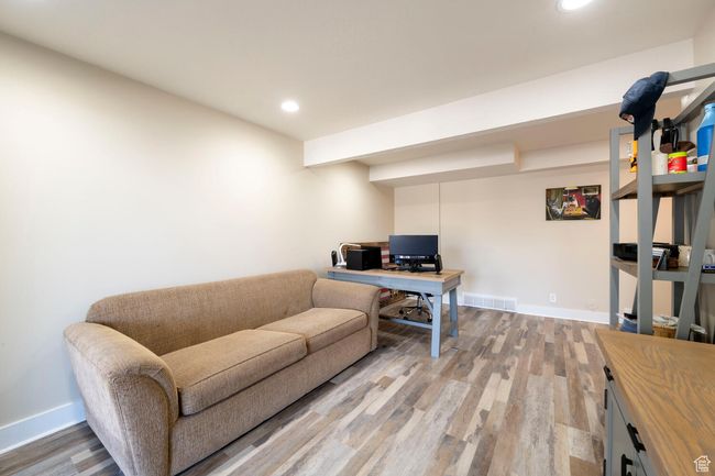 Home office with wood finished floors, baseboards, and recessed lighting | Image 35