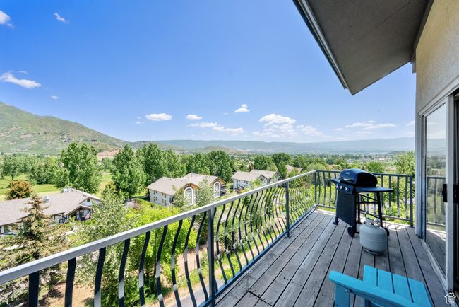Balcony with grilling area and a mountain view | Image 22