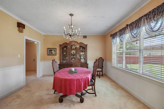 The formal dining sits at the back of the home and has an oversized window with spectacular views of the backyard. | Image 11