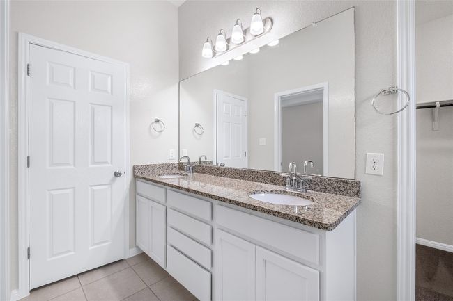 Full bath with double vanity and tile patterned flooring | Image 26