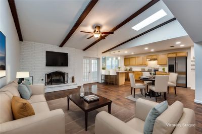 Beautiful beams in the casual living room with a gas fireplace | Image 1