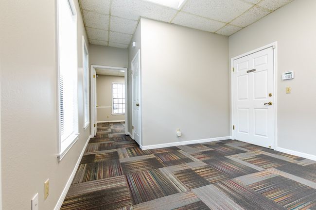 Entrance foyer featuring dark carpet and a paneled ceiling | Image 6