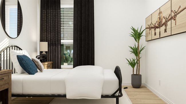 Bedroom featuring wood finished floors and baseboards | Image 7