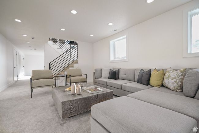 Living room with recessed lighting, stairway, light colored carpet, and baseboards | Image 20