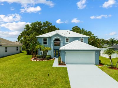 6450 Nw Hacienda Ln, House other with 5 bedrooms, 3 bathrooms and null parking in Port St. Lucie FL | Image 1