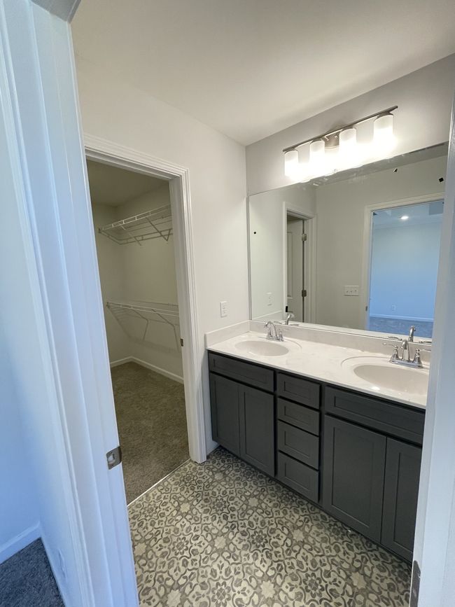 Primary bathroom with double sinks and primary closet | Image 9