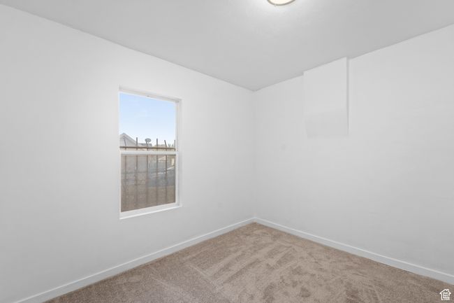 Carpeted spare room with baseboards | Image 22