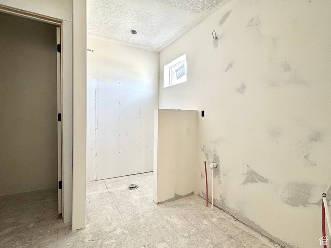 Bathroom featuring a textured ceiling | Image 18