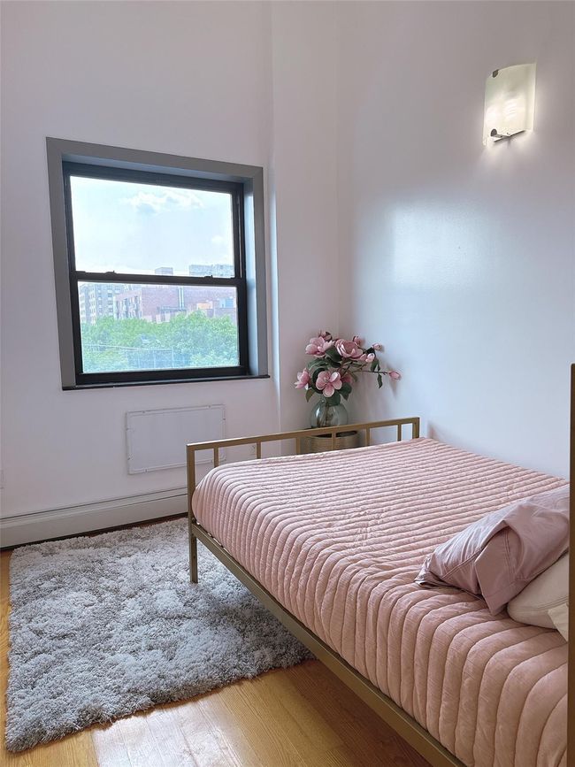 Bedroom featuring wood finished floors | Image 7